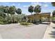 Well-maintained community entrance with lush landscaping and mature palm trees at 13618 Greenfield Dr # 105, Tampa, FL 33618