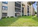 Condo exterior with well maintained grounds and screened in lanais at 13618 Greenfield Dr # 105, Tampa, FL 33618