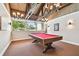 Recreational game room with a pool table, unique lighting, and a charming atmosphere for fun activities at 13618 Greenfield Dr # 105, Tampa, FL 33618