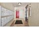 Well-maintained hallway with mailboxes, tiled flooring, and elevator access at 13618 Greenfield Dr # 105, Tampa, FL 33618