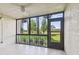 Screened lanai with ceiling fan overlooking the well manicured grounds at 13618 Greenfield Dr # 105, Tampa, FL 33618