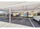 Covered parking area with assigned parking spaces, providing shade and protection for vehicles at 13618 Greenfield Dr # 105, Tampa, FL 33618