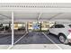 Designated covered parking spots provide shelter for resident's vehicles at 13618 Greenfield Dr # 105, Tampa, FL 33618