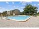Serene community pool with ample space for relaxation and enjoyment with lounge chairs at 13618 Greenfield Dr # 105, Tampa, FL 33618