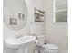 Charming powder room with pedestal sink and nautical-themed decor at 14110 Damselfly Dr, Tampa, FL 33625