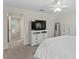 Bright primary bedroom featuring a TV and lots of closet space at 14110 Damselfly Dr, Tampa, FL 33625
