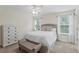 Bright bedroom with a comfortable bed, dresser and ample natural light at 14110 Damselfly Dr, Tampa, FL 33625