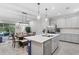 Open-concept kitchen and dining area featuring a center island, stainless steel appliances, and backyard access at 14110 Damselfly Dr, Tampa, FL 33625