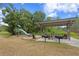 Neighborhood park with playground and picnic area with grills at 14110 Damselfly Dr, Tampa, FL 33625
