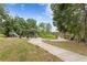 A neighborhood park featuring a playground, covered picnic area, and a walkway to the lake at 14110 Damselfly Dr, Tampa, FL 33625