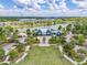 An aerial shot of the community center, green lawn, and pathways leading to the building at 16712 Courtyard Loop, Land O Lakes, FL 34638
