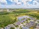 A high angle shows the home's location in a community near a pond and conservation area at 16712 Courtyard Loop, Land O Lakes, FL 34638