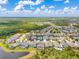 This high-angle view shows how close this home is to the neighborhood and nearby green areas at 16712 Courtyard Loop, Land O Lakes, FL 34638