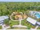 A birds-eye view of community amenities: playground, pool, pathways, and greenery at 16712 Courtyard Loop, Land O Lakes, FL 34638