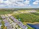 An aerial view shows proximity to a nature preserve, with mature trees and a pond at 16712 Courtyard Loop, Land O Lakes, FL 34638