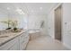 Bright bathroom features double vanity, soaking tub, and glass-enclosed shower at 16712 Courtyard Loop, Land O Lakes, FL 34638