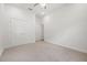 Spacious bedroom with plush carpeting and a large closet at 16712 Courtyard Loop, Land O Lakes, FL 34638