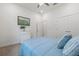 Bedroom featuring a plush bed and neutral-toned walls at 16712 Courtyard Loop, Land O Lakes, FL 34638
