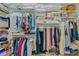 Walk-in closet with shelving and hanging rods at 16712 Courtyard Loop, Land O Lakes, FL 34638