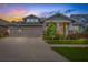 Charming single-Gathering home with a well-manicured lawn at sunset at 16712 Courtyard Loop, Land O Lakes, FL 34638