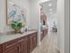 Kitchen space featuring dark wood cabinets with light countertops and stainless steel appliances at 16712 Courtyard Loop, Land O Lakes, FL 34638