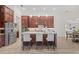 Gourmet kitchen with a large center island, stainless steel appliances, and custom cabinets, perfect for entertaining at 16712 Courtyard Loop, Land O Lakes, FL 34638