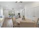Open-concept living room and dining space filled with natural light and stylish furniture at 16712 Courtyard Loop, Land O Lakes, FL 34638