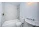 Tiled bathroom with tub, toilet and sink at 1799 N Highland Ave # 106, Clearwater, FL 33755