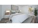Cozy bedroom with a comfortable bed, soft lighting, and a window offering a pleasant view of the outdoors at 1799 N Highland Ave # 106, Clearwater, FL 33755