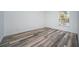 This bedroom has attractive wood-look flooring, is freshly painted, and has great natural light at 1799 N Highland Ave # 106, Clearwater, FL 33755