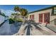 Exterior of community center with fenced-in back with ample parking at 1799 N Highland Ave # 106, Clearwater, FL 33755