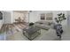 Open-concept living and dining area with hardwood floors, neutral furnishings, and ample natural light at 1799 N Highland Ave # 106, Clearwater, FL 33755