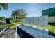Mailboxes for condo residents in a landscaped area with palm trees and a sidewalk at 1799 N Highland Ave # 106, Clearwater, FL 33755