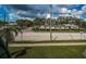 Street view of the condo community showing landscaping, parking, and the speed limit sign at 1799 N Highland Ave # 106, Clearwater, FL 33755