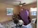 Bedroom featuring natural light from two windows and ample space for a restful night's sleep at 1806 Marvy Ave, Tampa, FL 33612