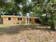 Charming single-story home with bright exterior paint and white shutters at 1806 Marvy Ave, Tampa, FL 33612