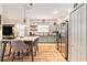 Eat in kitchen featuring painted cabinets, stainless steel appliances, and lots of natural light at 18113 Ashton Park Way, Tampa, FL 33647