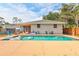 Backyard oasis featuring a sparkling pool, patio area, and lush landscaping at 2620 49Th N Ave, St Petersburg, FL 33714