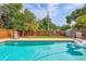 Private backyard retreat with a sparkling pool and lush greenery, perfect for outdoor living at 2620 49Th N Ave, St Petersburg, FL 33714