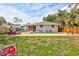 Well-maintained backyard featuring a refreshing pool, patio area, and a privacy fence for outdoor enjoyment at 2620 49Th N Ave, St Petersburg, FL 33714