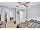 Bedroom with mirrored closet and ceiling fan, and doorway leading to another room at 2620 49Th N Ave, St Petersburg, FL 33714