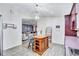 Well-lit kitchen with cozy wooden center island and open view to living room at 2620 49Th N Ave, St Petersburg, FL 33714