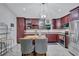 Inviting kitchen with stainless appliances, a center island, and wood cabinets at 2620 49Th N Ave, St Petersburg, FL 33714