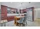 Kitchen with stainless appliances, wood cabinets, and a cozy center island at 2620 49Th N Ave, St Petersburg, FL 33714
