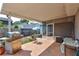 Covered patio featuring outdoor grill and seating area overlooking the backyard at 2620 49Th N Ave, St Petersburg, FL 33714