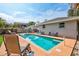 Inviting backyard pool with ample seating and sunbathing space for outdoor enjoyment at 2620 49Th N Ave, St Petersburg, FL 33714