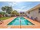 Beautiful backyard pool surrounded by lush landscaping and a private, fenced yard at 2620 49Th N Ave, St Petersburg, FL 33714