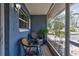 Cozy screened-in porch with seating, offering a relaxing outdoor space with a neighborhood view at 2620 49Th N Ave, St Petersburg, FL 33714