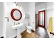 Bathroom featuring a white sink and toilet and a shower behind a curtain at 2621 Stearns Rd, Valrico, FL 33596