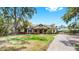 Attractive home featuring a well-manicured lawn and a paved driveway at 2621 Stearns Rd, Valrico, FL 33596